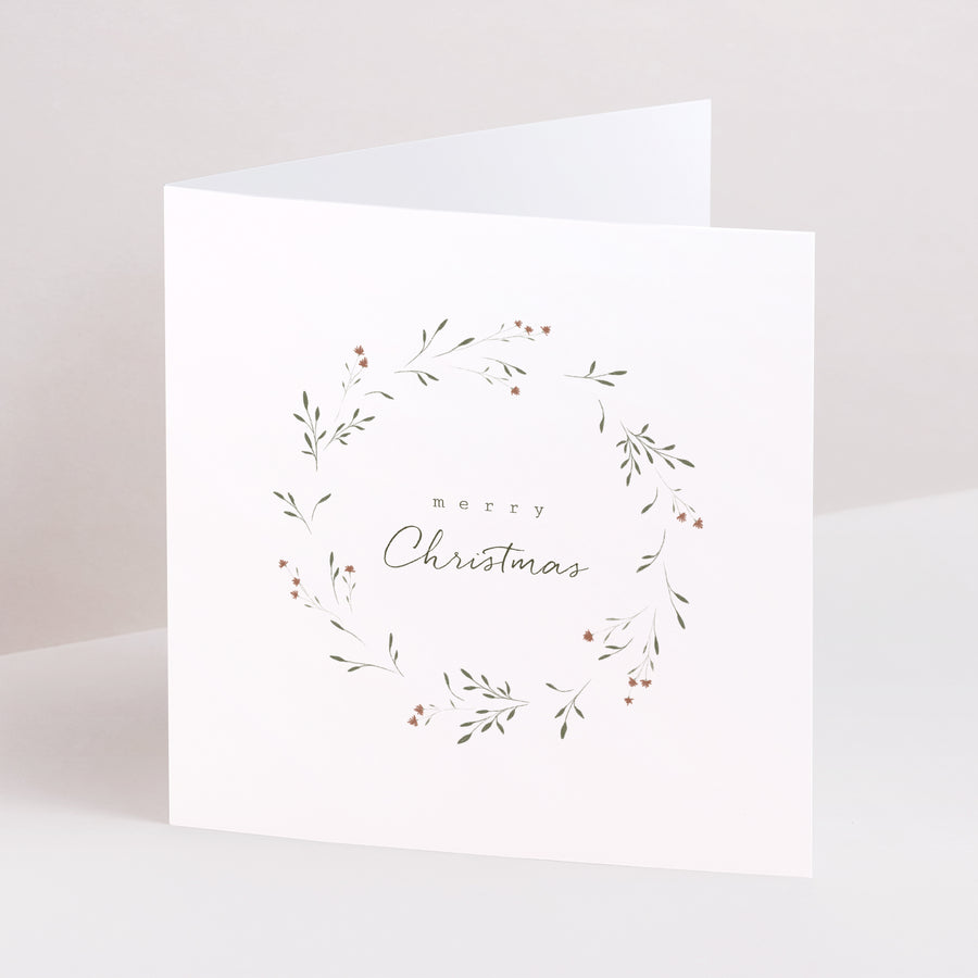 Weihnachtskarte Weihnachten Doppelflügiges Quadrat Pflanzen- und Blumenkranz foto