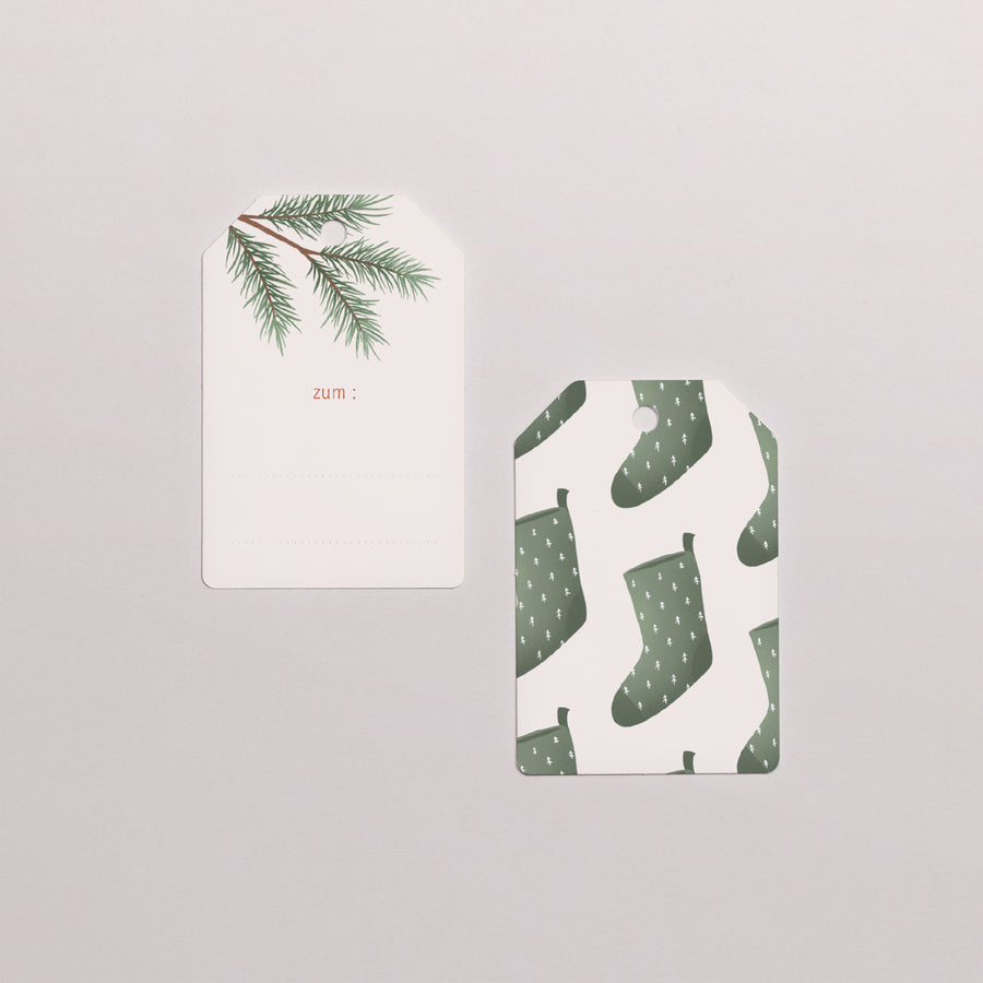 Vorgelochtes Etikett Weihnachten Fähnchen Weihnachtsbaumzweige foto