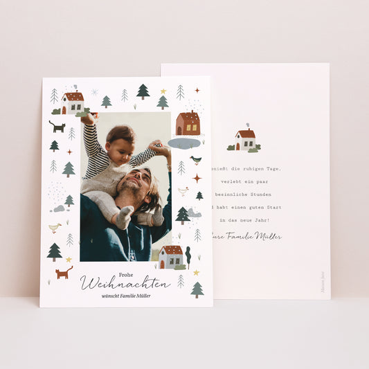 Weihnachtskarte Weihnachten Häuser, See, Tannenbäume foto
