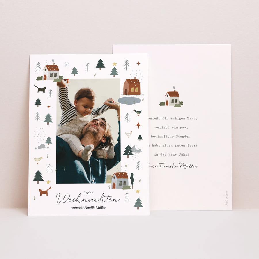 Weihnachtskarte Weihnachten Häuser, See, Tannenbäume foto