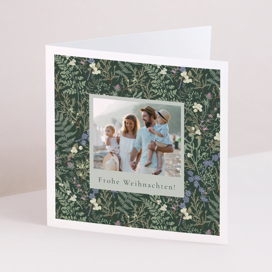 Weihnachtskarte Weihnachten Doppelflügelfenster Winterlaub foto